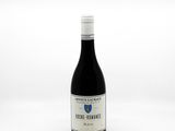 a bottle of wine that is sitting on a table