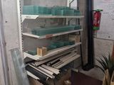 a room with a bunch of shelves and boxes on the floor