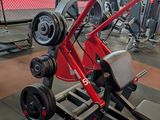 a red scooter that is sitting in a gym