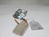 an image of a ring with a blue topazt stone on it