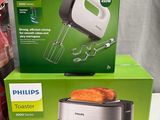 philips toaster and a blender sitting on a table next to each other