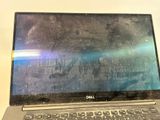 a laptop computer that is sitting on a table