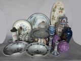 many different types of vases and bowls on the table