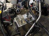 a lot of vacuums and other equipment in a room