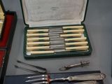 many different types of knives and knives in a case
