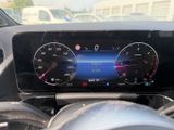 a car dashboard with a digital display and steering wheel