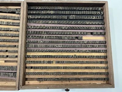 many different type of letters in a wooden box