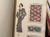 an open book with a picture of a woman in a dress