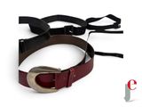 a belt with a metal buckle on it on a white surface