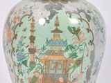 a vase with a lid that has a picture of a pagoda on it