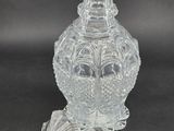 an image of a clear glass vase sitting on top of a table