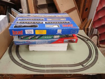 a train set sitting on top of a table next to a box