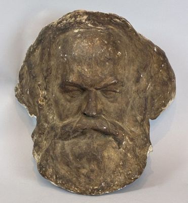 a stone head of a man with a beard