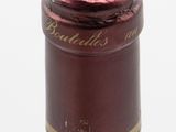 a bottle of wine that is sitting on a table