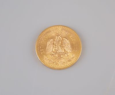 an image of a gold coin on a white surface