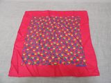 a close up of a red blanket with a pattern on it