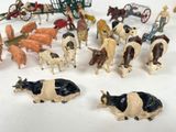 a lot of toy animals that are on a table
