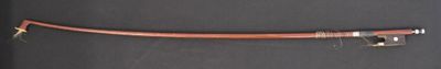 a brown pipe attached to a black wall