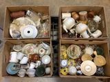two boxes filled with different types of cups and saucers