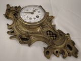 a clock that is sitting on a white table