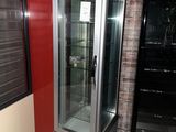 an image of a refrigerator in a room with a brick wall