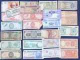 a lot of different types of paper money on the table
