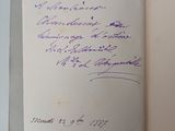 an open book with handwriting on it sitting on a table