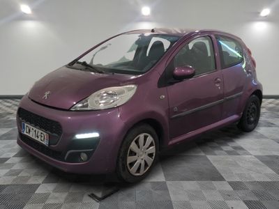 a picture of a purple small car parked in a garage