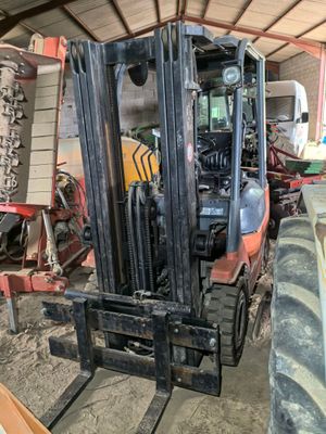 a forklift that is parked inside of a building
