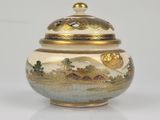 an image of a vase with a lid on a white surface