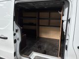 a white van with open doors in a parking lot