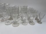 a lot of empty wine glasses sitting on a table