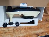 a toy boat that is in a box on a table