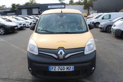 a yellow and black van parked in a parking lot