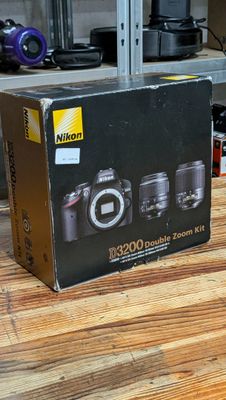 a box of cameras sitting on a table in a room