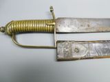 pair of old and worn swords on a white surface