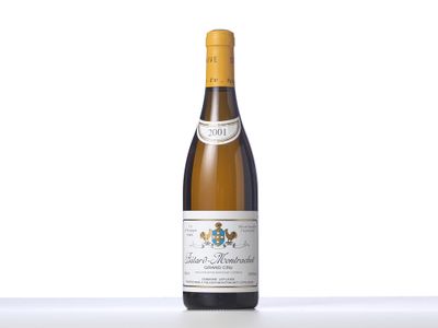 a bottle of white wine sitting on top of a table