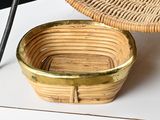 a wicker basket sitting on a table next to a pair of scissors