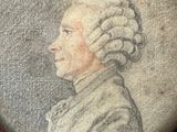 an old picture of a man with a white wig and a white shirt