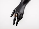a close up of a person ' s hand with a ring on it
