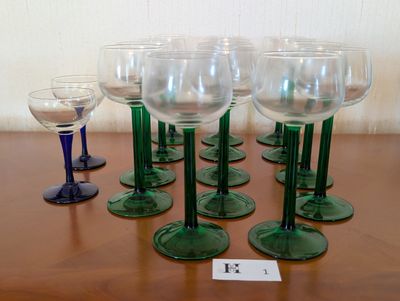 several wine glasses are lined up on a table with a price tag