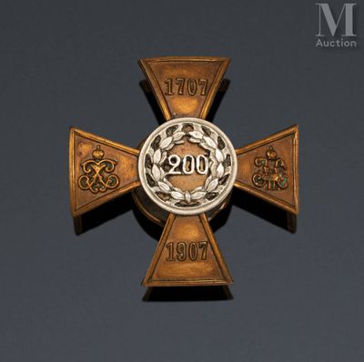 a close up of a cross with a medallion on it