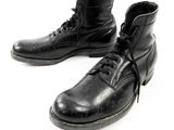 pair of black leather boots with laces on a white background