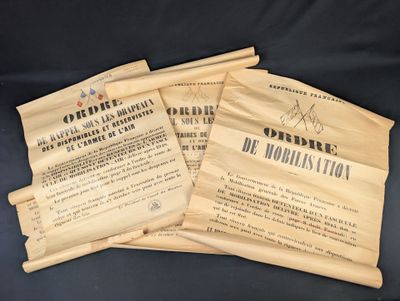 three old papers are sitting on a table with a black background