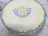 a cake that is sitting on a table with blue and white decorations