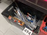 a picture of a bunch of screws in a box