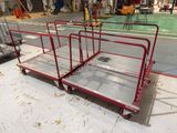 a red cart that is sitting on the floor