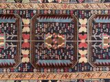 an image of a blue and red rug with a design on it