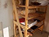 a wooden shelf that has a lot of items on it