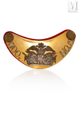 an image of a close up of a gold plate with a crown on it